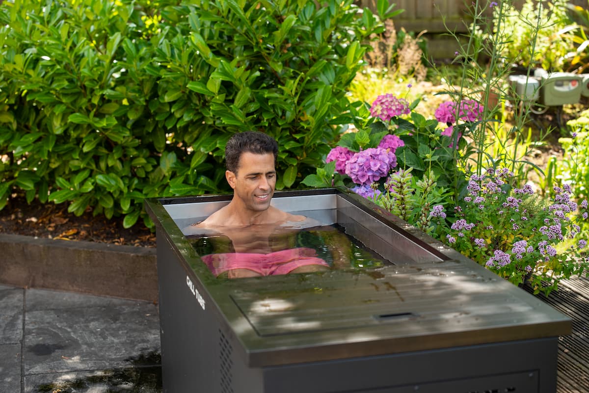 A man enjoying a Chill Tub ice bath in a Liverpool garden.